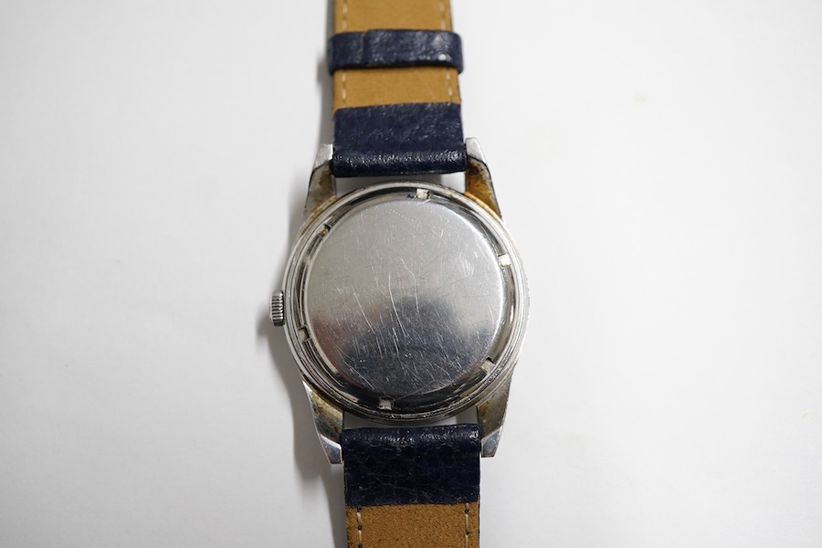 A gentleman's stainless steel Girard Perregaux Gyromatic wrist watch, with baton numerals, case diameter 33mm, on a later associated leather strap, no box or papers.